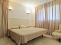 Appartamento con 2 camere da letto a Punta Prima per affitto a lungo termine * in Ole International